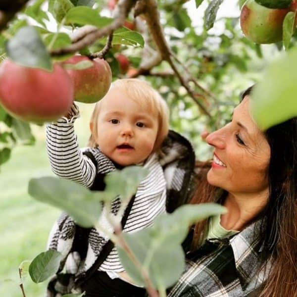 mom and child picking apples