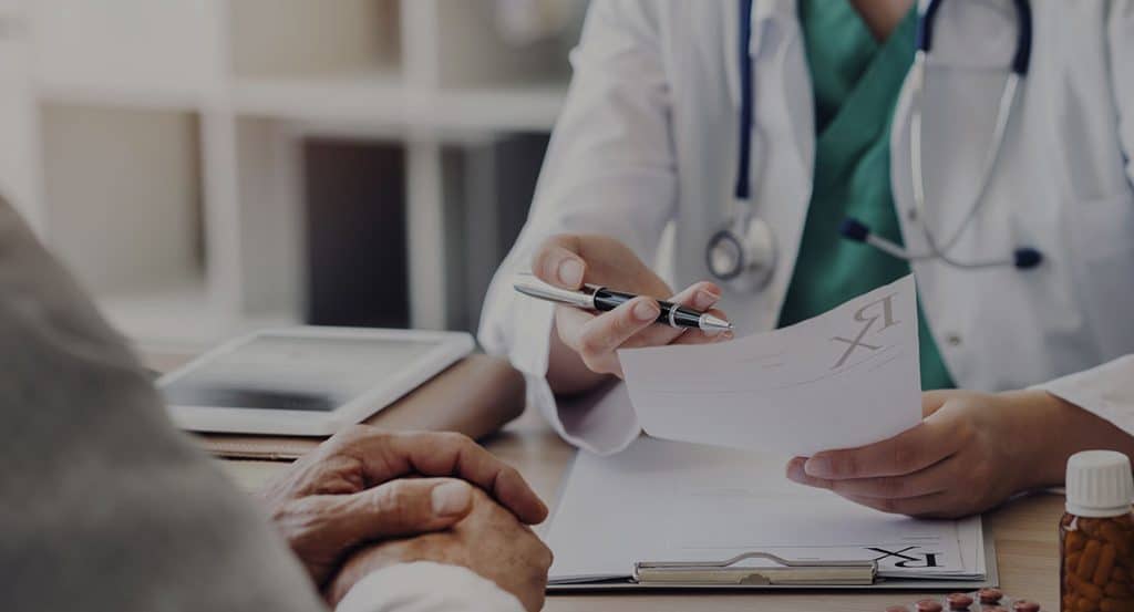 Doctor showing papers